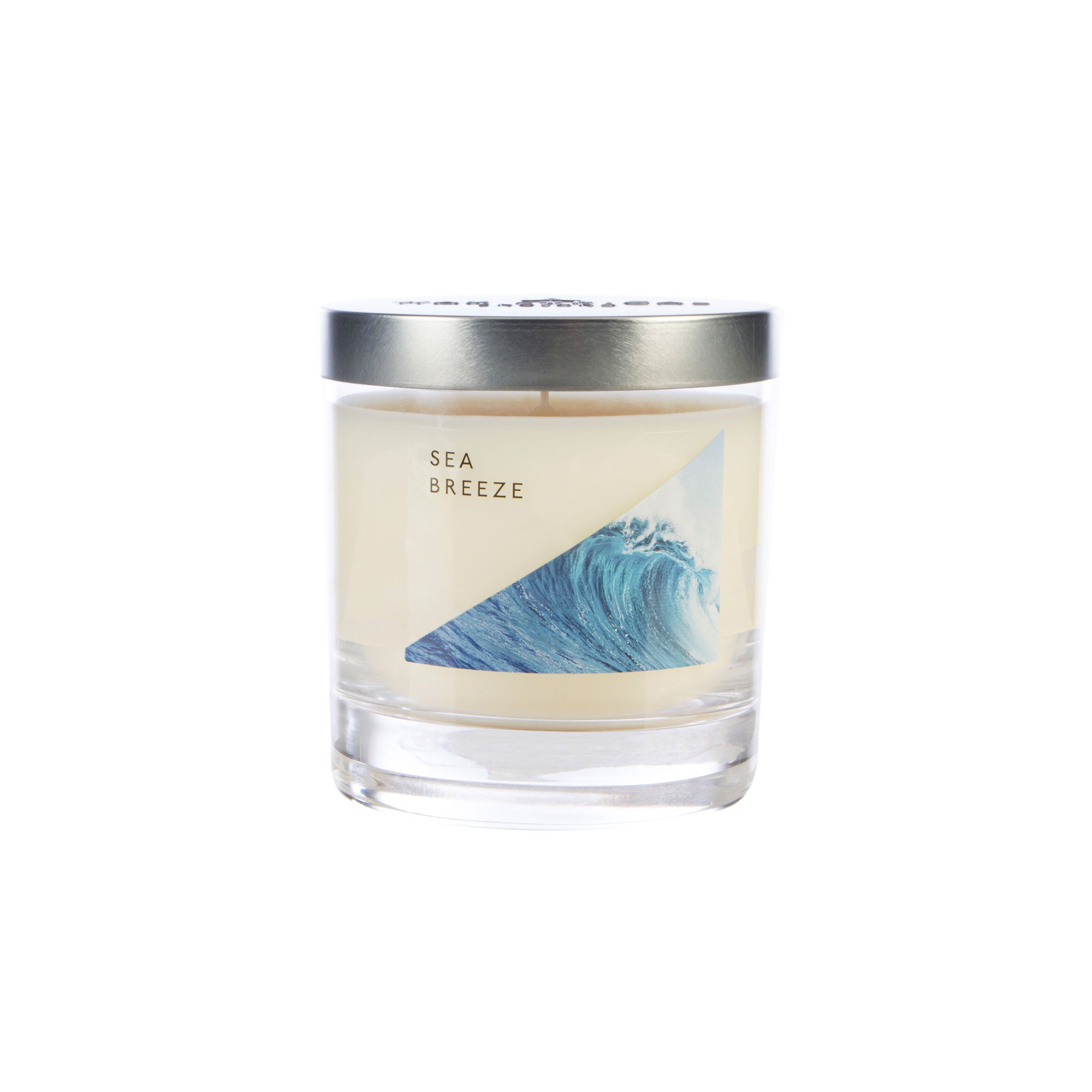 Wax Lyrical Made In England Sea Breeze Medium Tin Candles. A refreshing fragrance bringing watery notes to your home. A floral heart, fresh figs and woody notes, amber and musk.