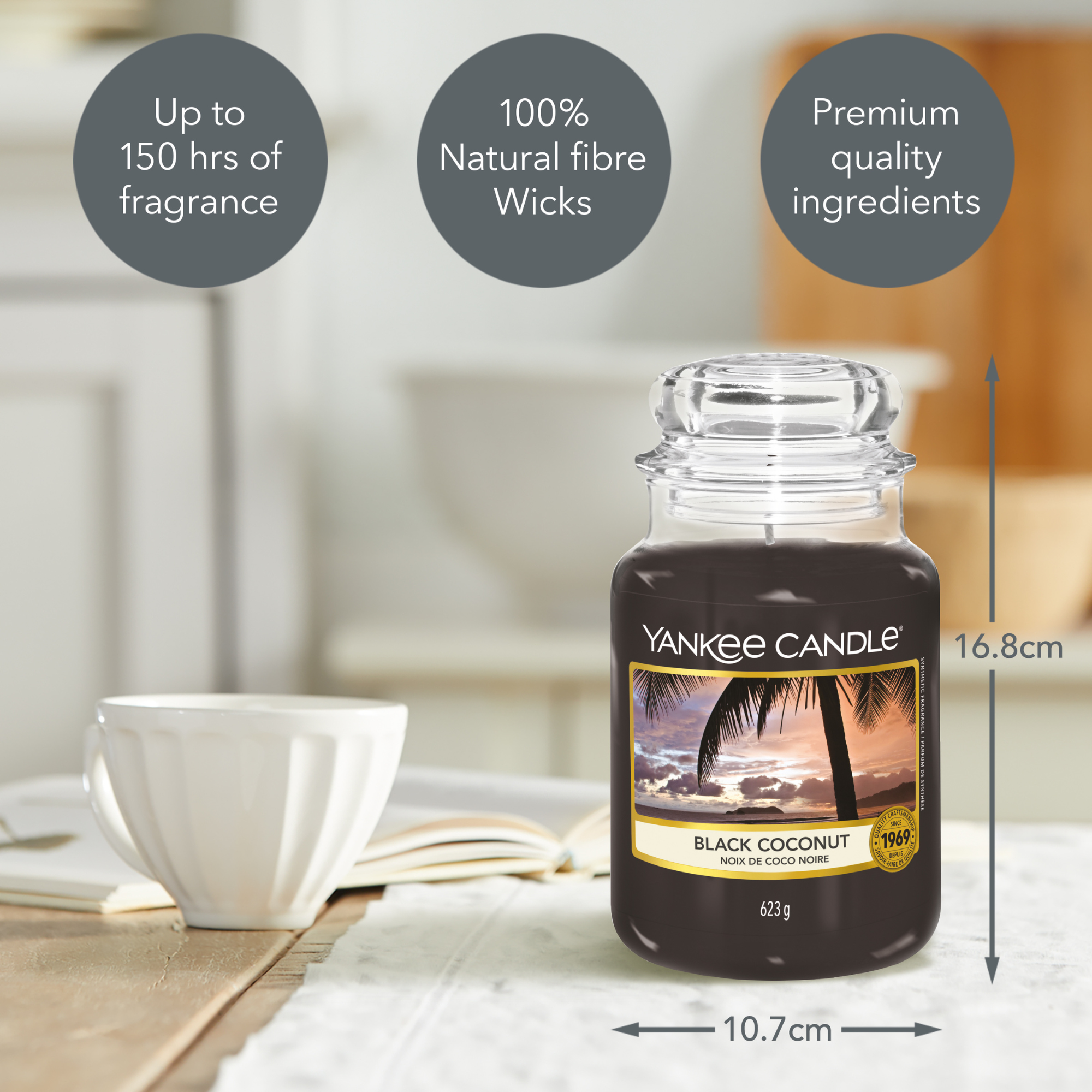 Yankee Candle Black Coconut Large Jar Candle. Notes of rich coconut, cedarwood and island blossoms promise a relaxing evening of luxurious calm tranquillity