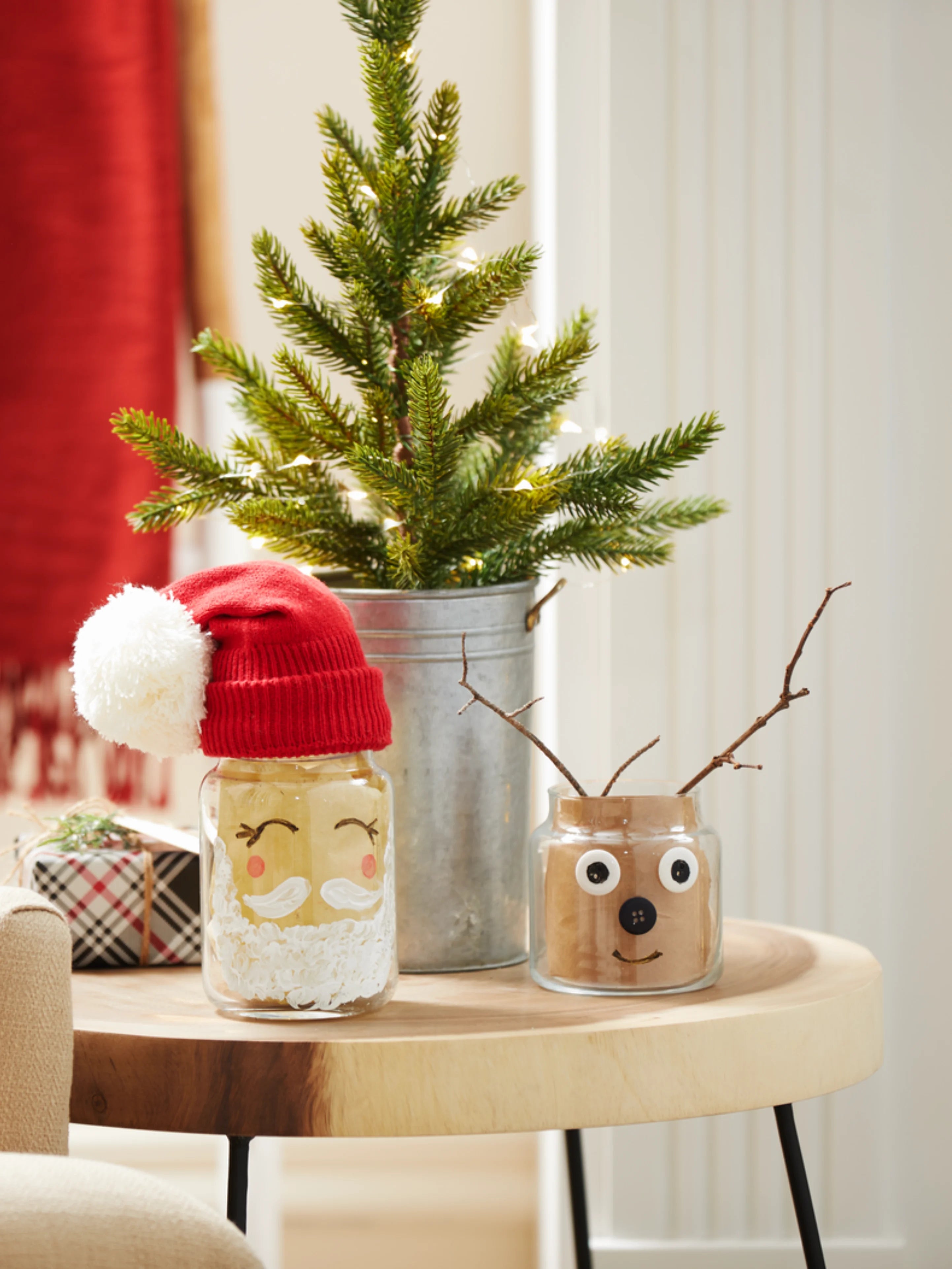 A DIY Christmas jar decorated  with a Christmas Santa on the jar. 