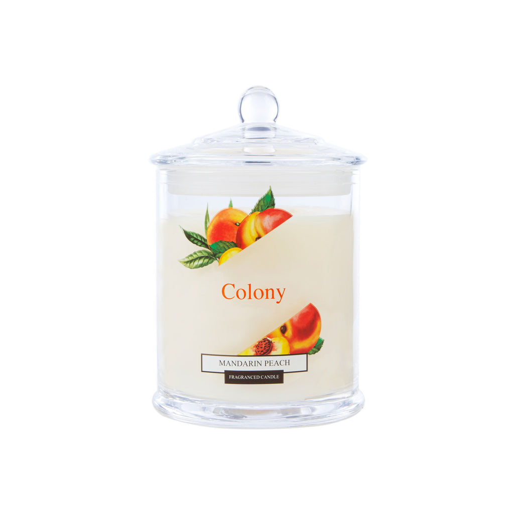 Wax Lyrical Colony Mandarin Peach Medium Candle. Mandarin, peach together with zesty lime, earthy basil, fresh lemongrass in this fruit bowl fragrance. Spearmint and moss and vetivert base create a scented base. 
