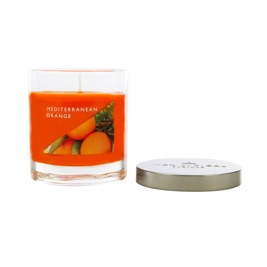 Wax Lyrical Made In England Mediterranean Orange Medium Tin Candles. Cherries spritz in this fruity fragrance, ripe strawberries and raspberries add rich red zest. Floral violet and vanilla create a sweet base. 