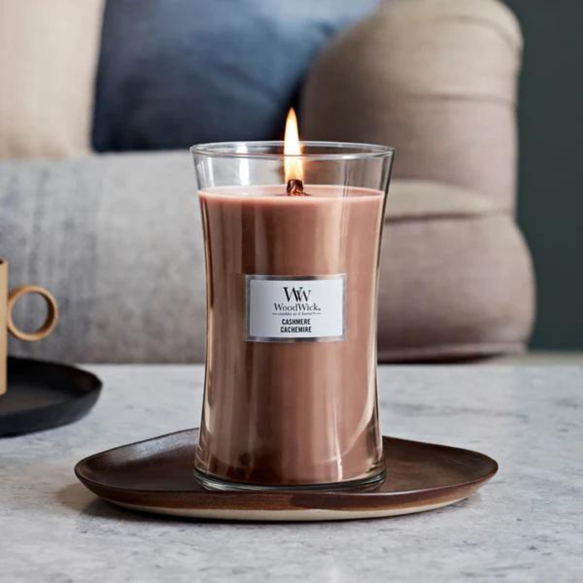 WoodWick Cashmere Large Hourglass Candle. Combination of fragrance notes — including sandalwood, tonka bean, and quince — blend to create a sumptuous, compelling scent.