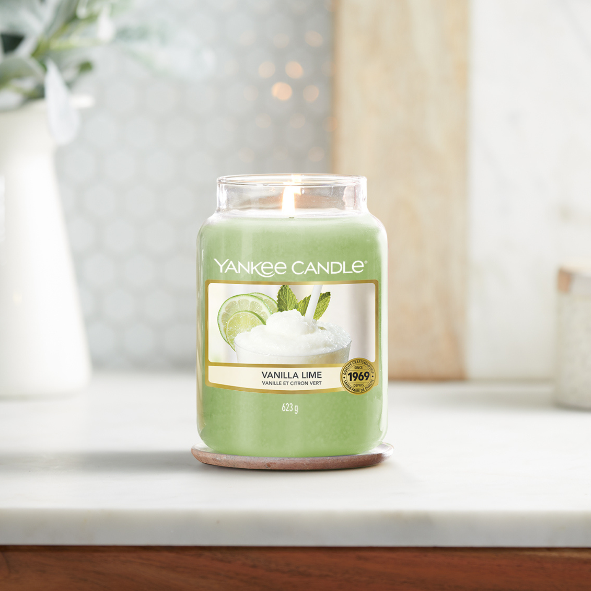 Yankee Candle Vanilla Lime Large Jar Candle. Refreshing aromas of rich, creamy vanilla combined with sweet cane sugar and a zesty lime twist